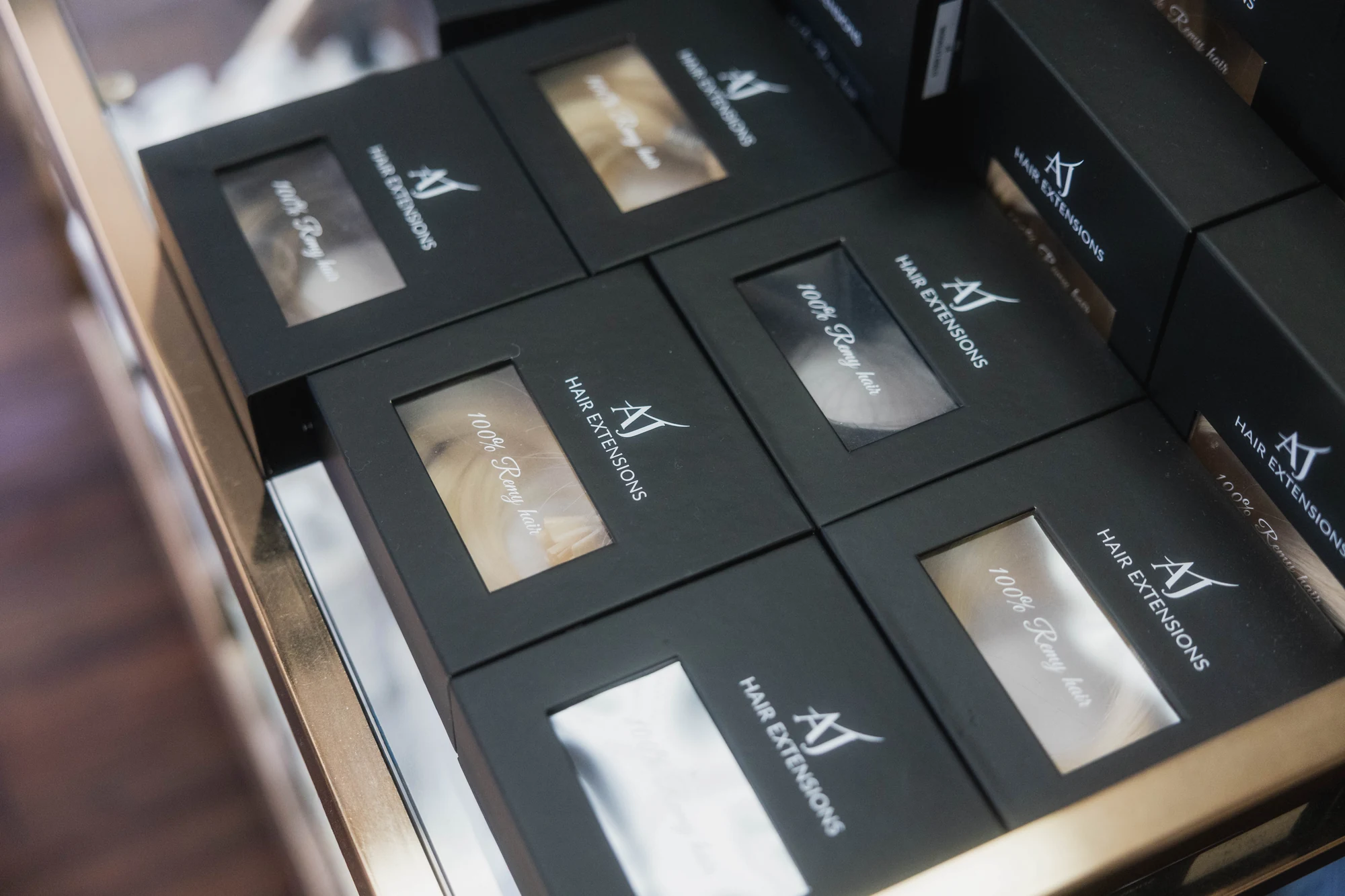 AJ Hair Extensions packaging photographed at Austin James Hair Studio