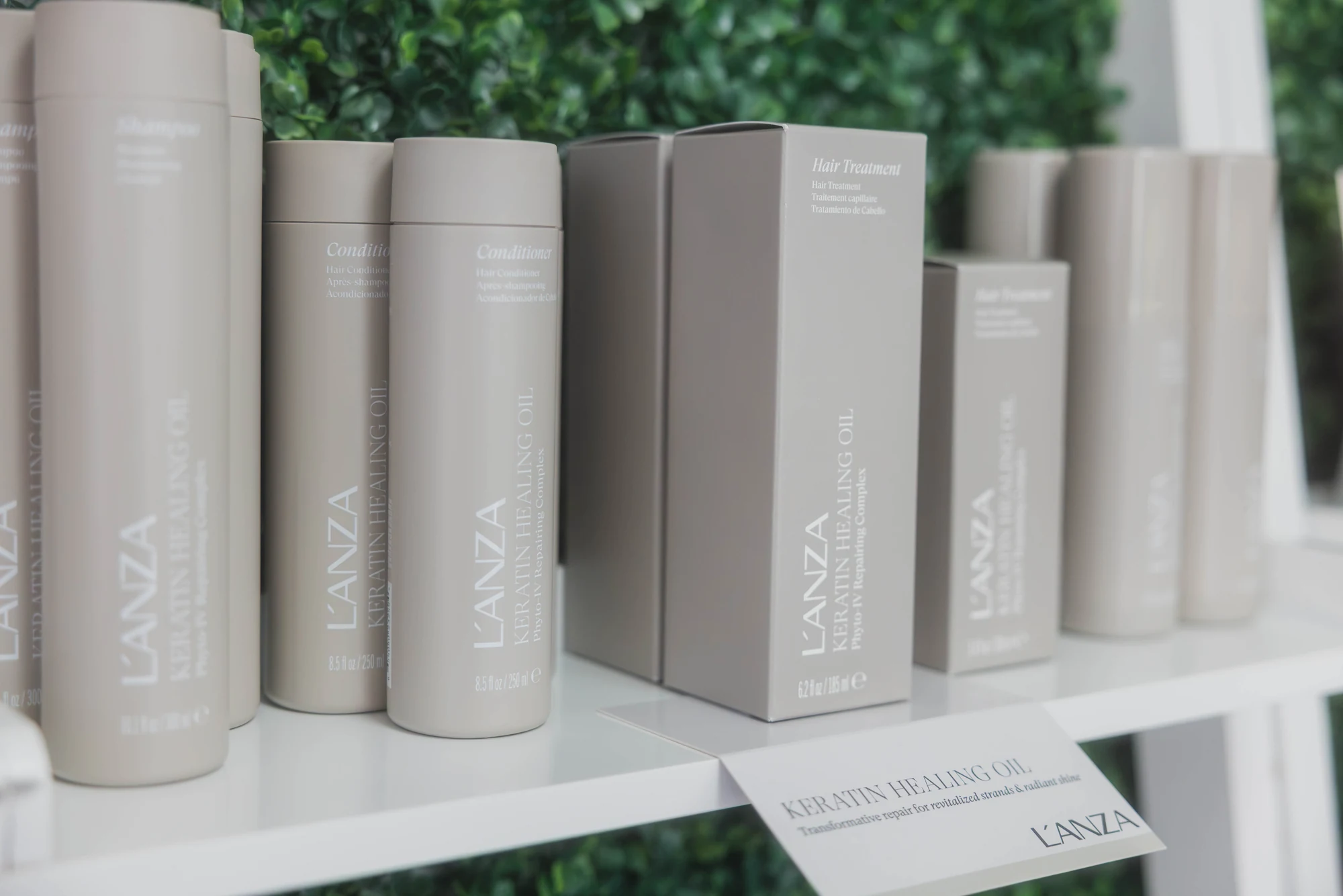 L’ANZA shampoo, conditioner and treatment products displayed together